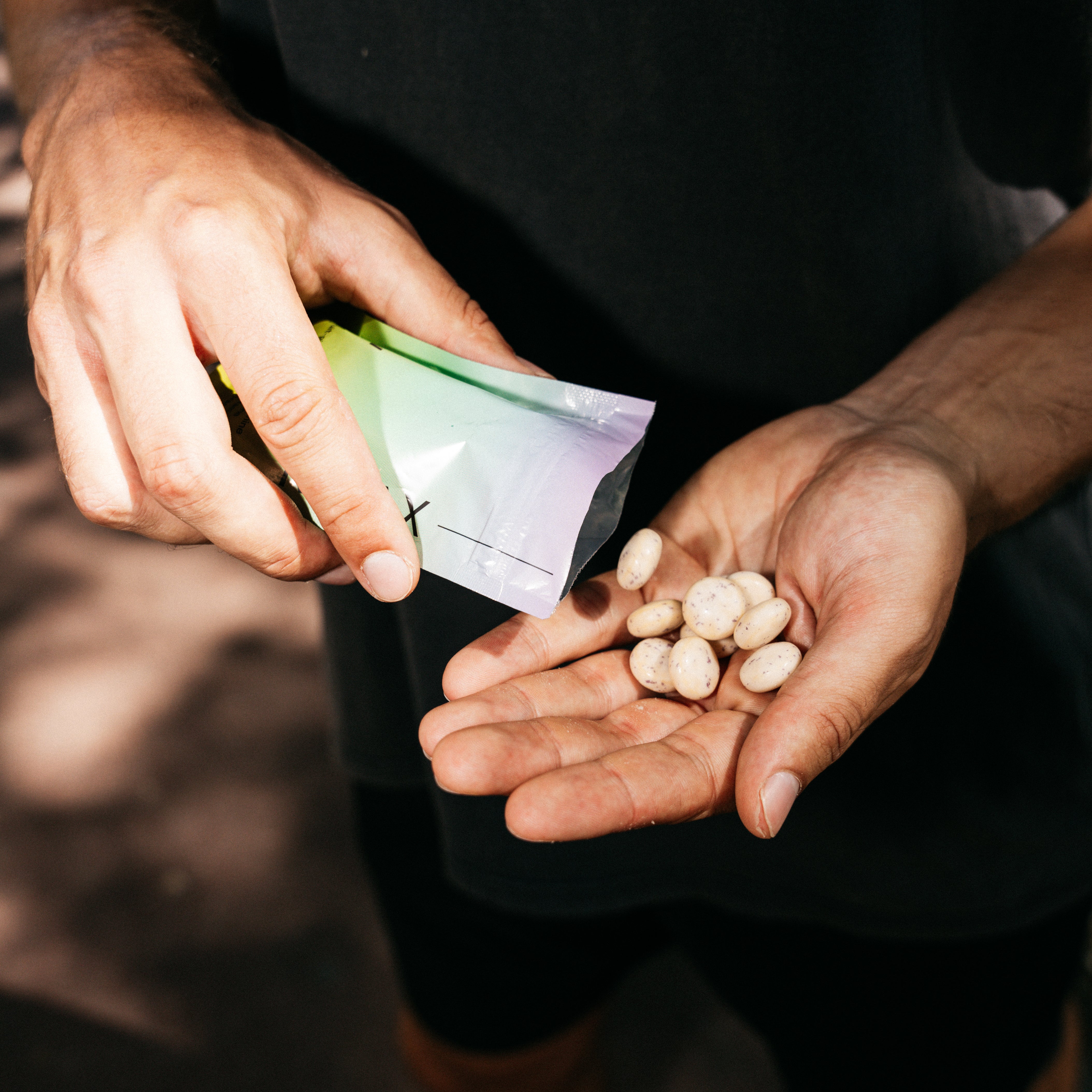Hiflow gum pieces in a person's palm.