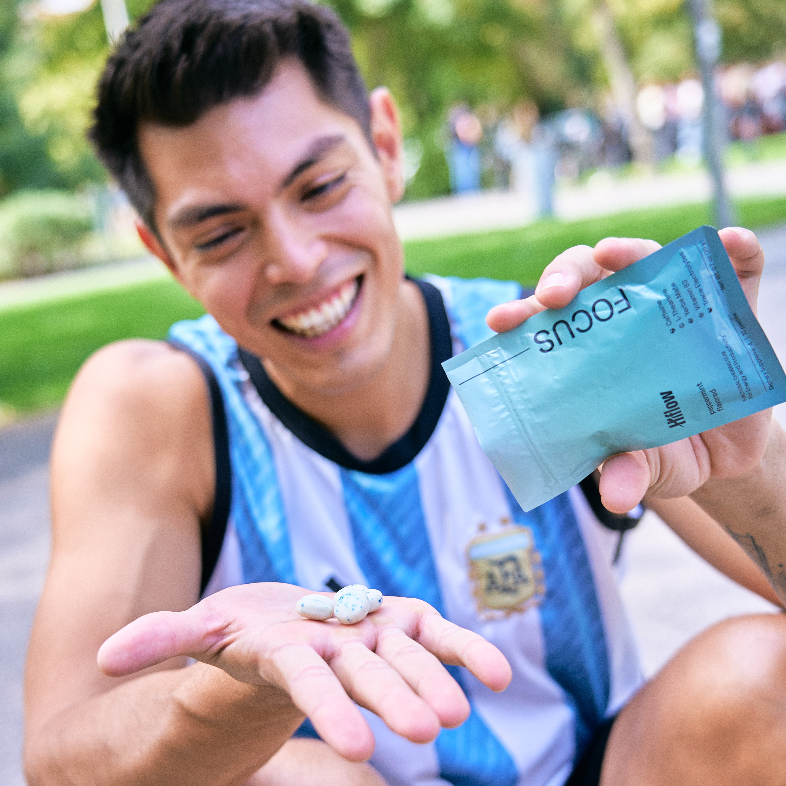 Person holding a 'Hiflow Focus' product package outdoors.