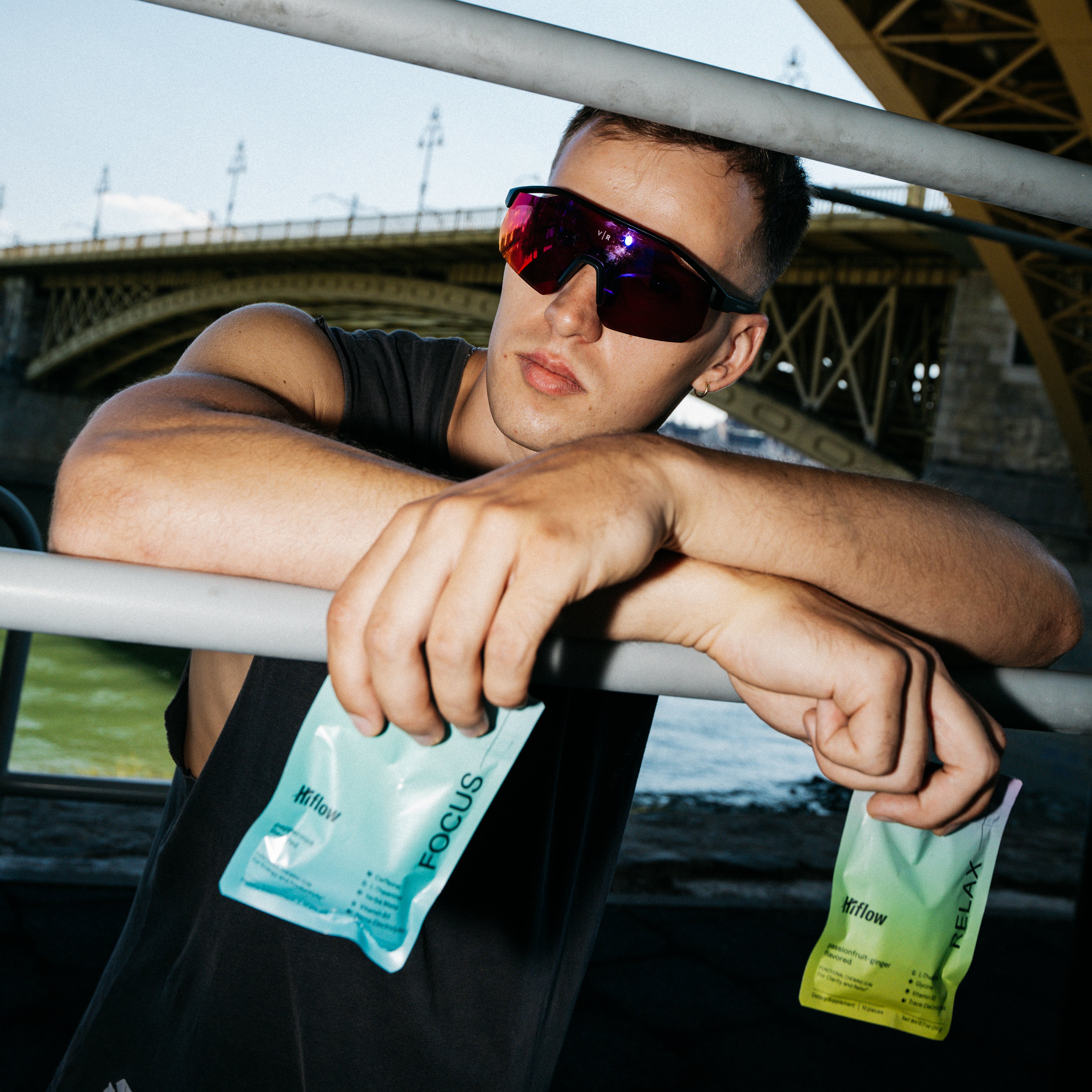 Male model holding Hiflow gum pouches.